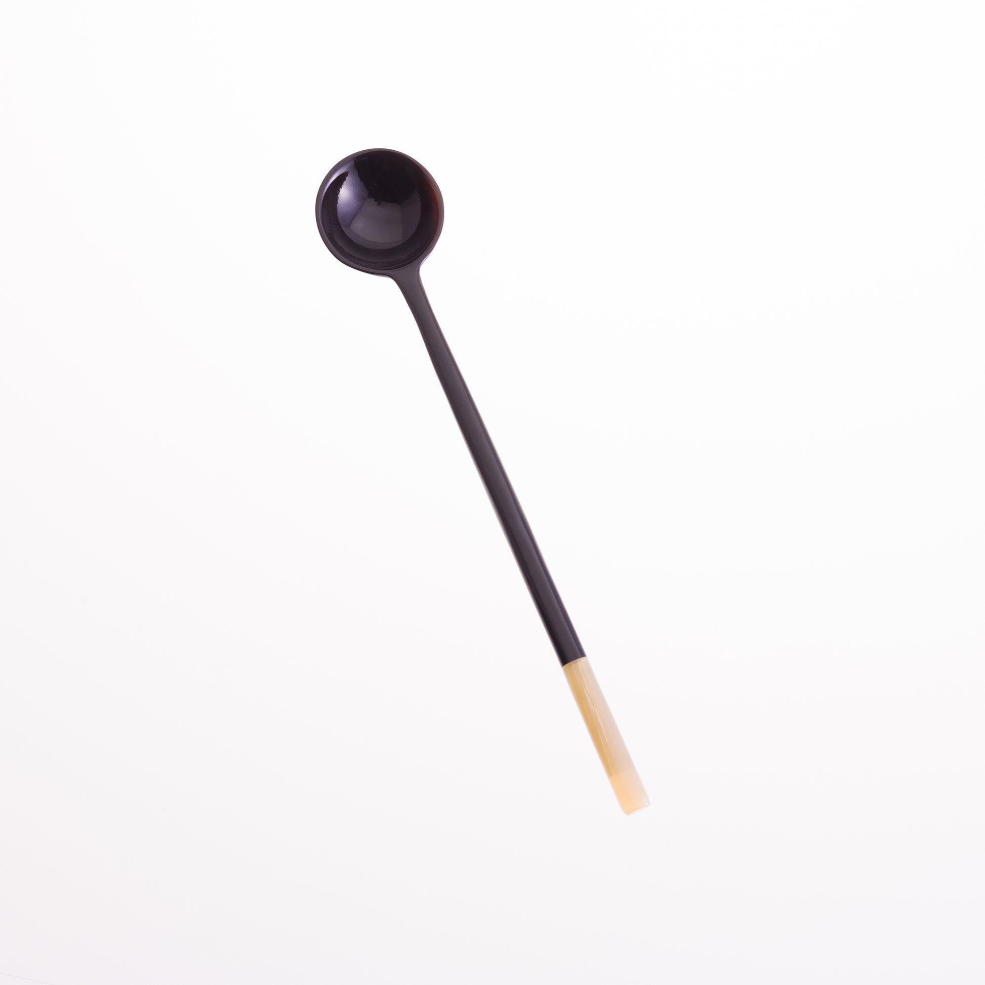 Long handled olive spoon made from black horn with a natural horn tip