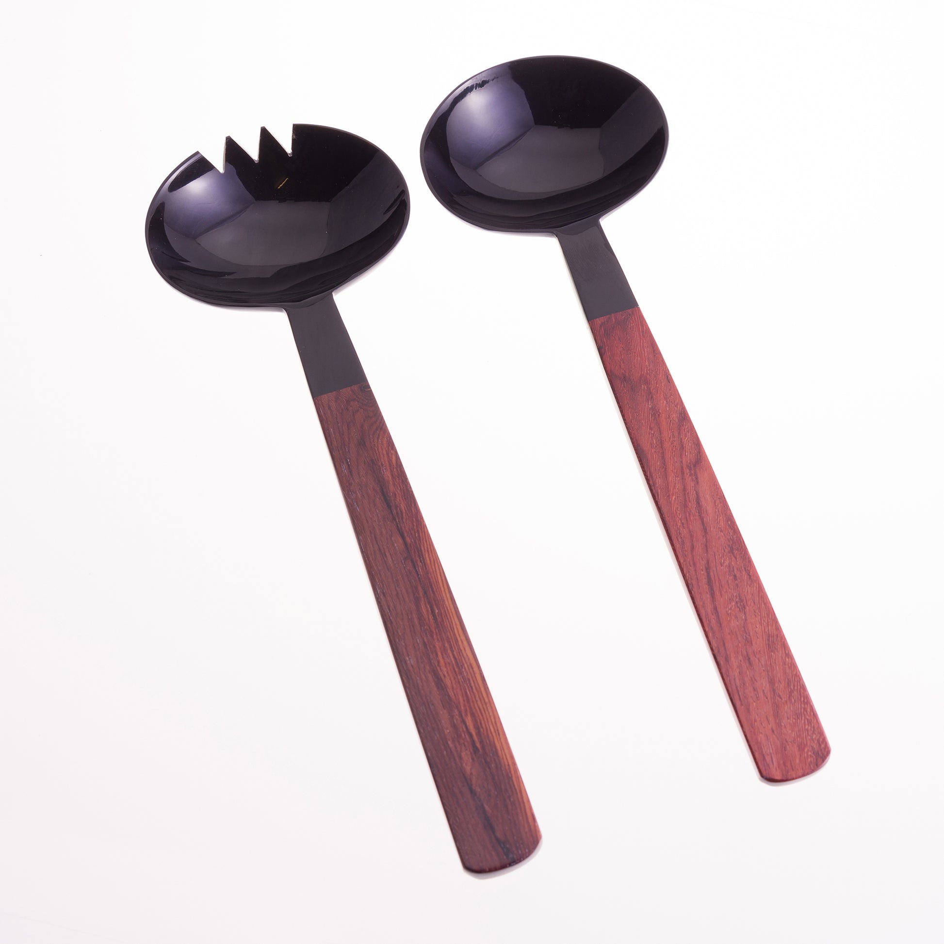 Pair of oval shaped black horn salad servers with rosewood handles